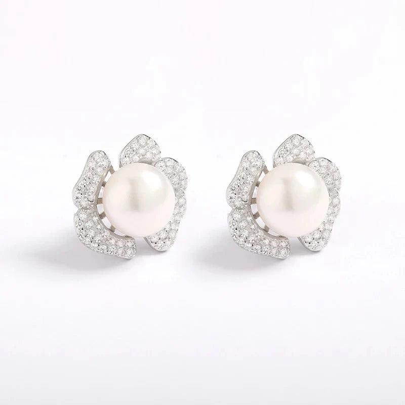 A pair of elegant pearl earrings, showcasing the beauty of lustrous pearls.